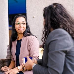 Two female colleagues meeting.
